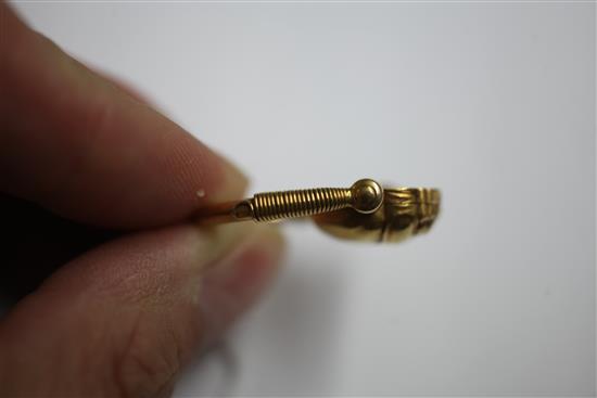 An early 20th century 14k gold swivelling Scarab locket ring, size N.